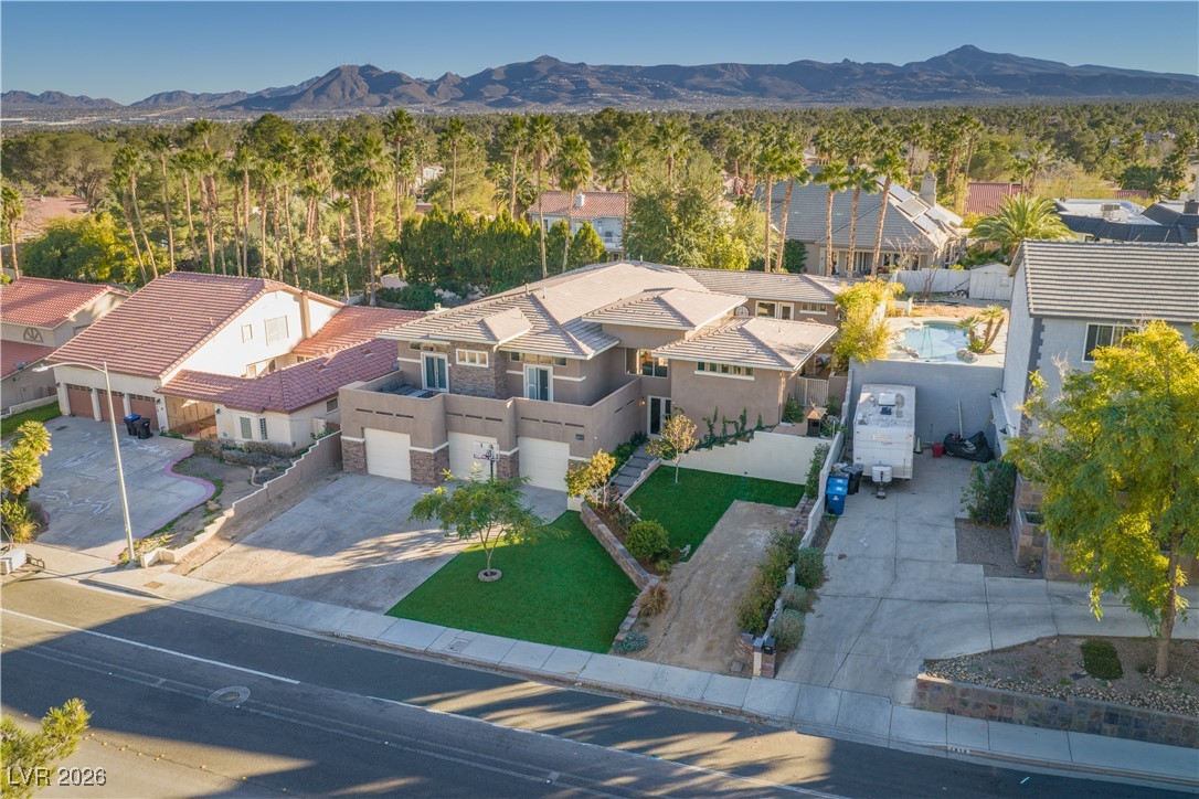 2817 High View Drive Henderson, NV 89014 - Photo 4 of 77 Aerial perspective of suburban area with a mountainous background