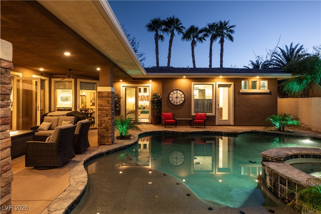 2817 High View Drive Henderson, NV 89014 - Photo 54 of 77 View of pool with an outdoor living space with a fire pit, a patio area, a fenced backyard, and a pool with connected hot tub
