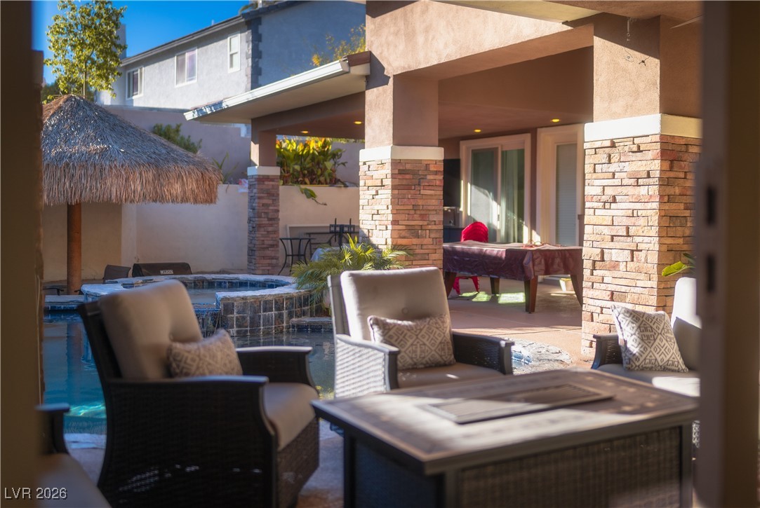 2817 High View Drive Henderson, NV 89014 - Photo 57 of 77 View of patio / terrace with a pool with connected hot tub and a gazebo