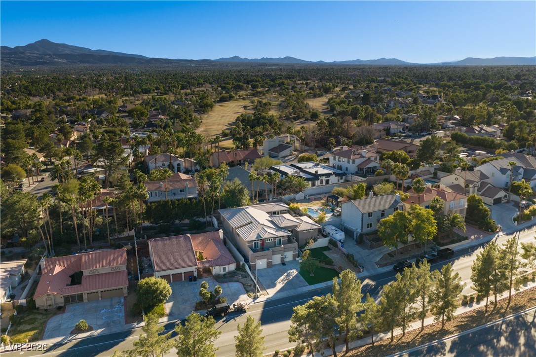 2817 High View Drive Henderson, NV 89014 - Photo 5 of 77 Aerial view of property's location with a mountainous background and nearby suburban area