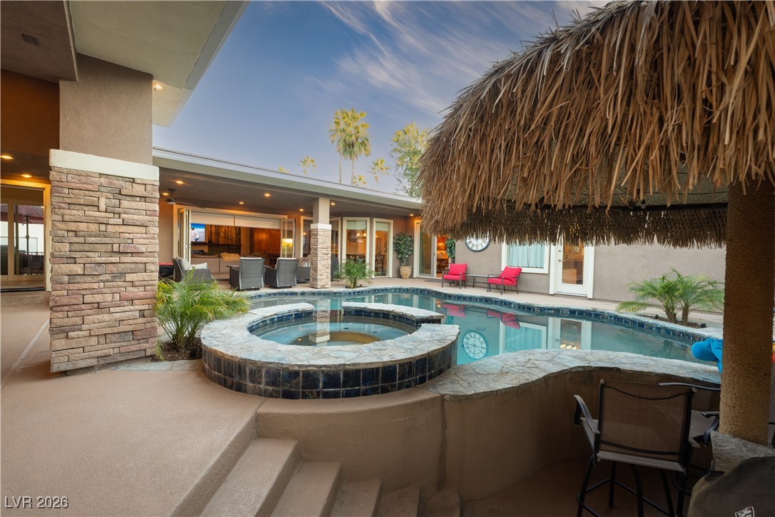 2817 High View Drive Henderson, NV 89014 - Photo 61 of 77 View of pool with a patio and a pool with connected hot tub
