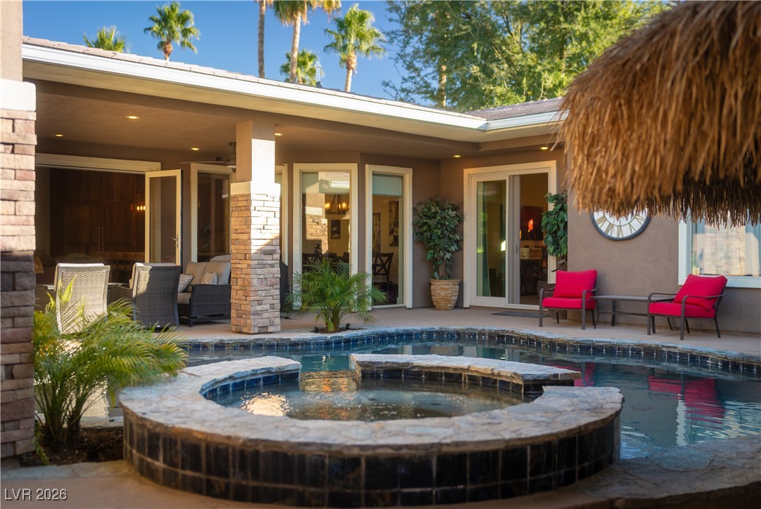 2817 High View Drive Henderson, NV 89014 - Photo 67 of 77 View of swimming pool featuring a pool with connected hot tub and a patio