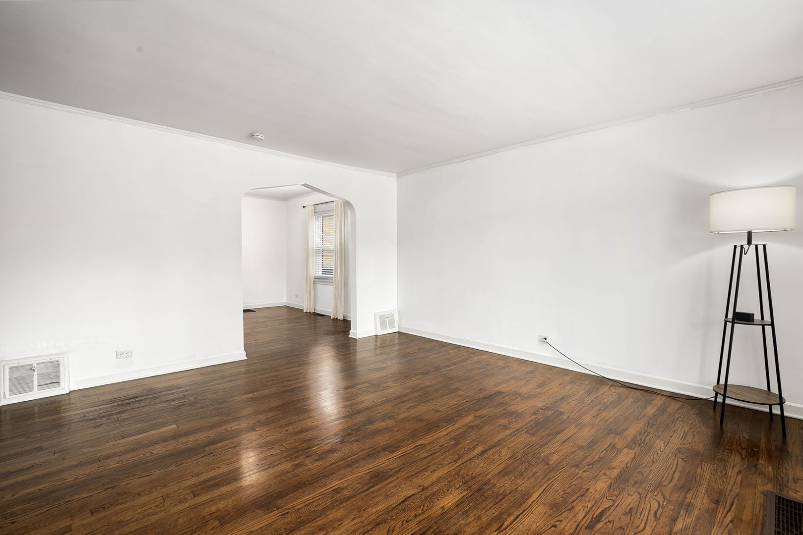 4237 Park Avenue Brookfield, IL 60513 - Photo 4 of 20 a view of an empty room with wooden floor and a window