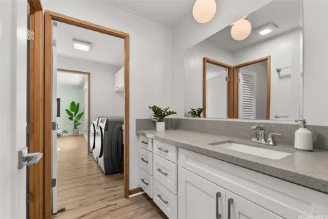 a bathroom with sink and mirror