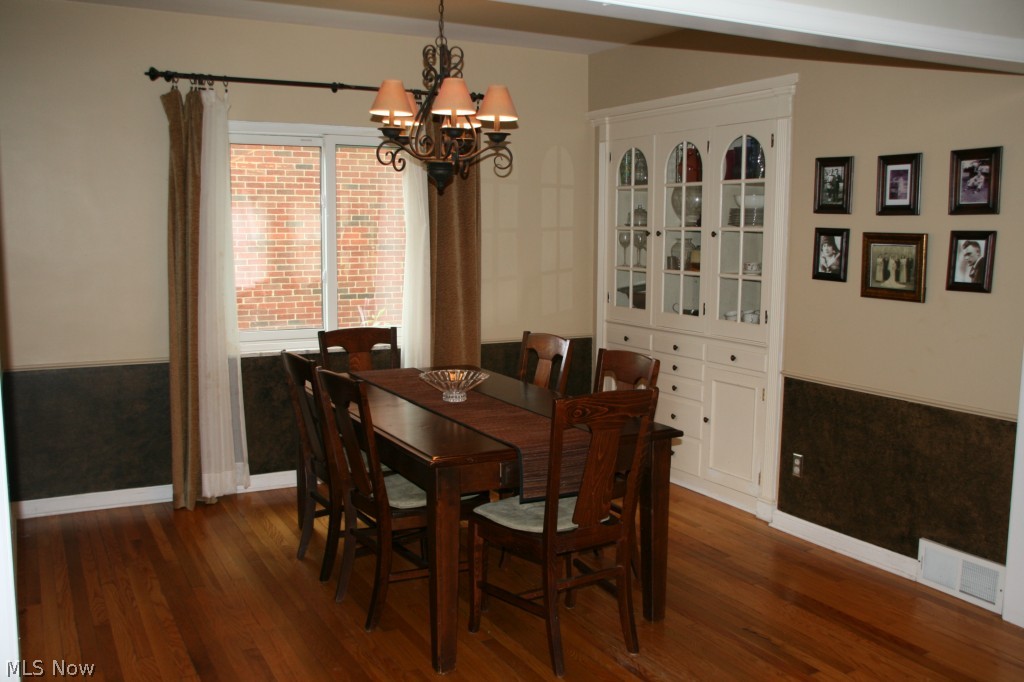 2452 Dysart Road Cleveland, OH 44118 - Photo 4 of 22 Spacious dining room boasts hardwood floors, accent chair rail and wonderful built-in china cabinet.