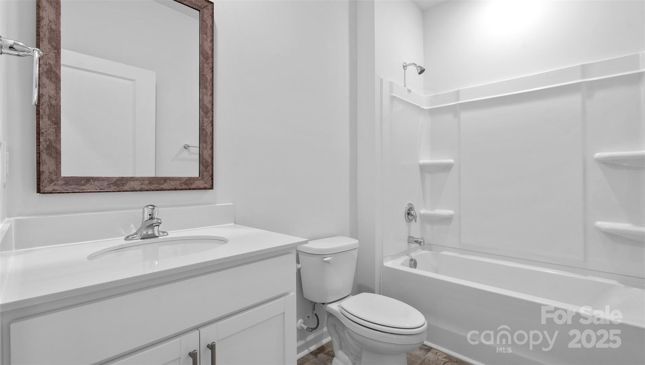 138 Bovine Br Road Fletcher, NC 28732 - Photo 11 of 20 a bathroom with a sink a toilet and shower