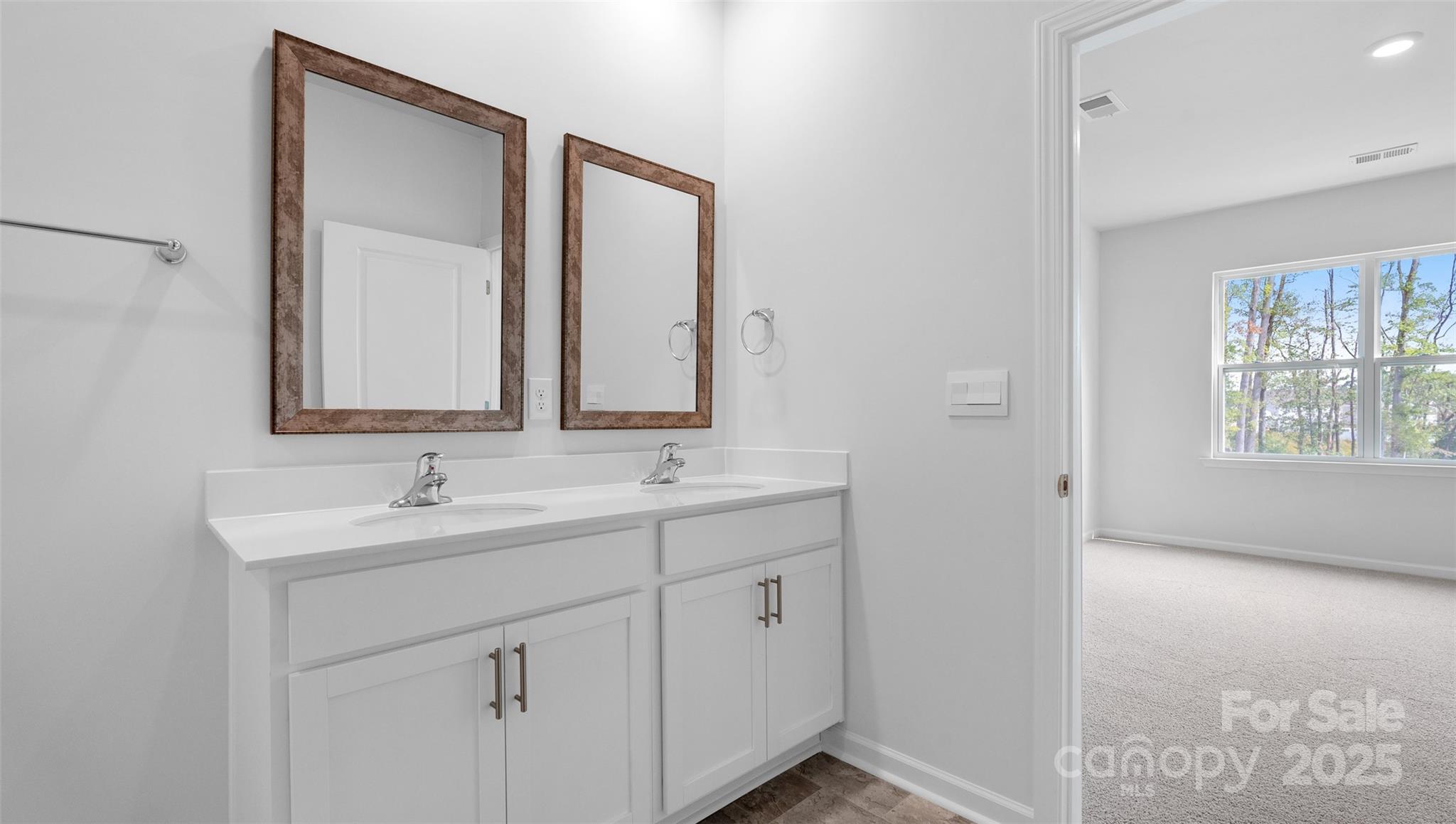 138 Bovine Br Road Fletcher, NC 28732 - Photo 13 of 20 a bathroom with 2 sink and a mirror