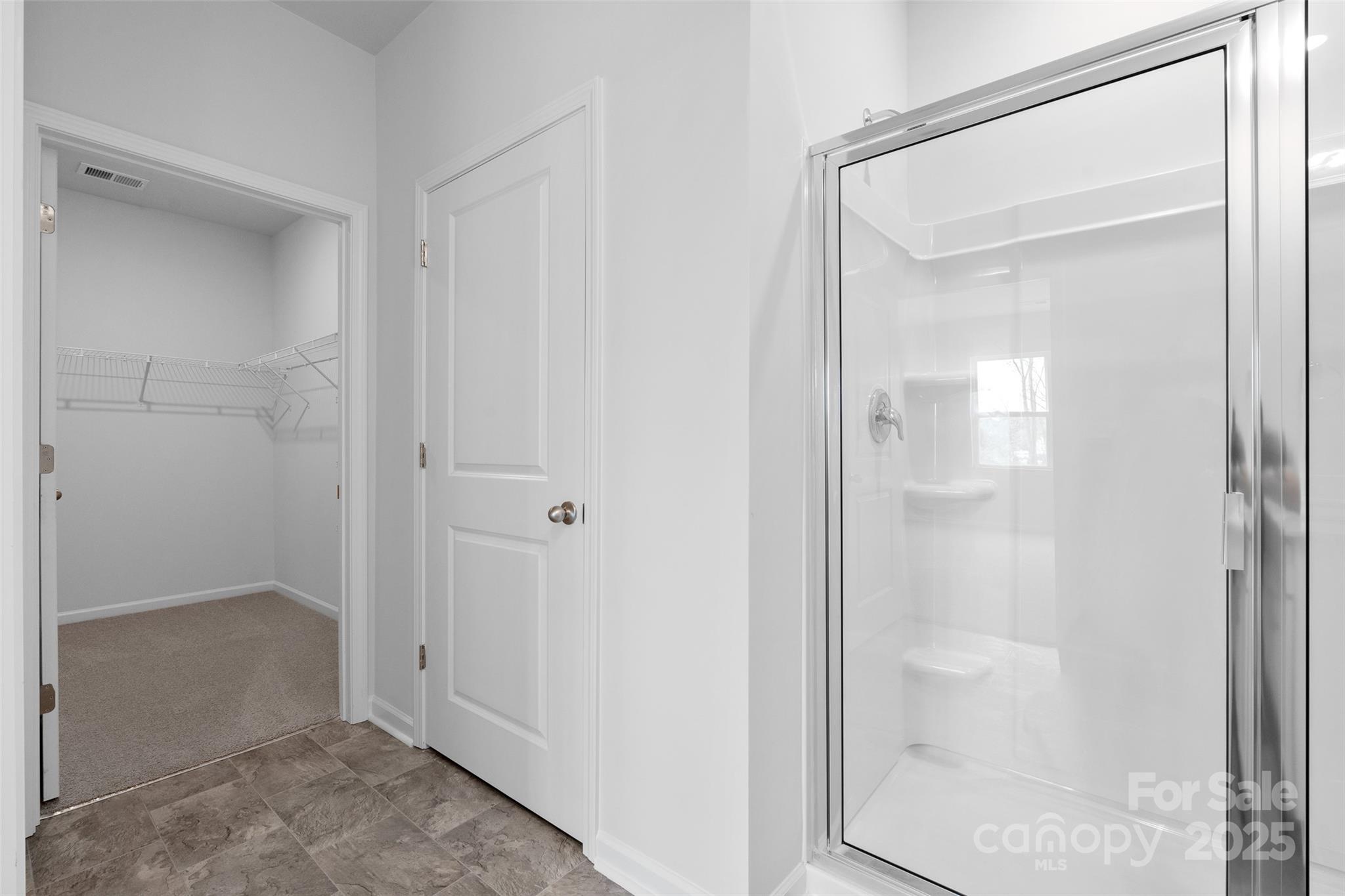 138 Bovine Br Road Fletcher, NC 28732 - Photo 17 of 20 a bathroom with a glass shower door
