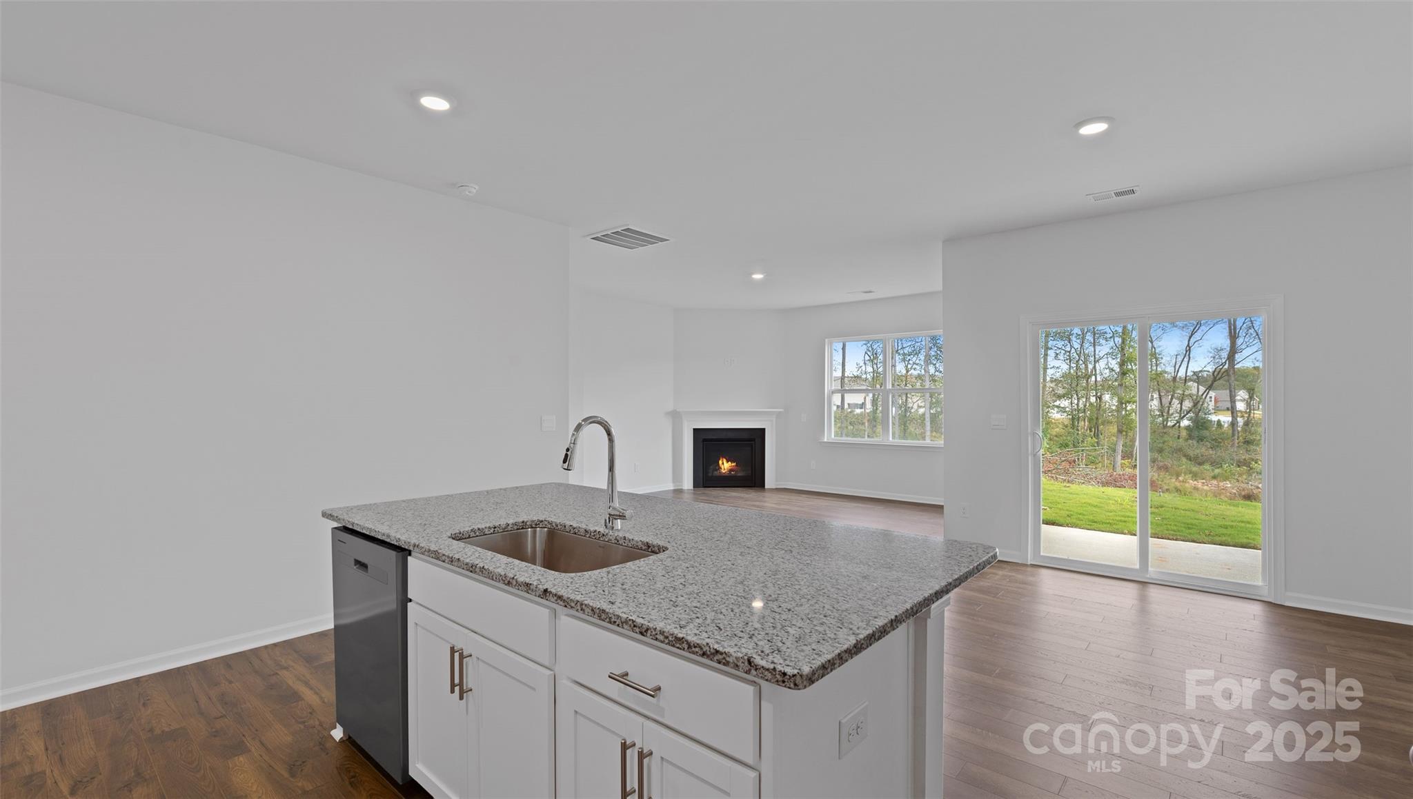 138 Bovine Br Road Fletcher, NC 28732 - Photo 5 of 20 a kitchen with granite countertop a sink and a stove