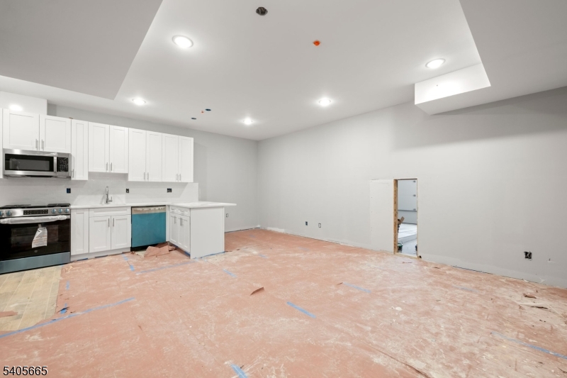 512 South 15th Street Newark, NJ 07103 - Photo 3 of 35 a view of a kitchen with white cabinets