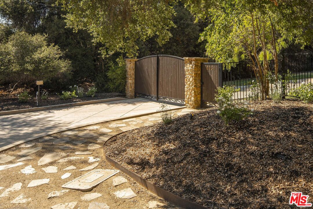 2251 Cold Canyon Road Calabasas, CA 91302 - Photo 37 of 47 a backyard of a house with lots of green space