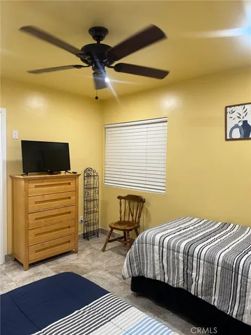a bedroom with a bed and a walk in closet
