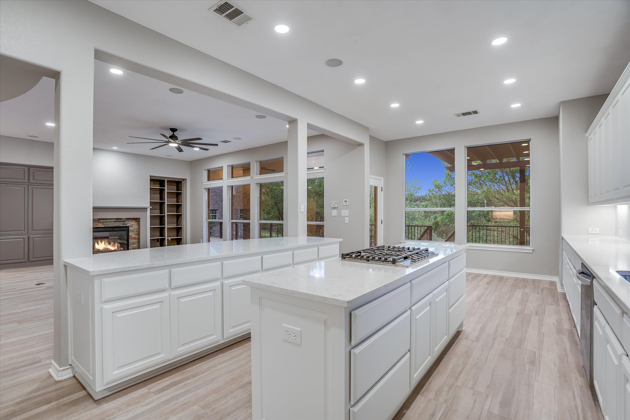 1400 Tom Sawyer Road Austin, TX 78737 - Photo 13 of 40 Large center island with gas cooktop and ample prep space.