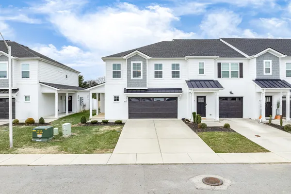 a front view of a house with yard