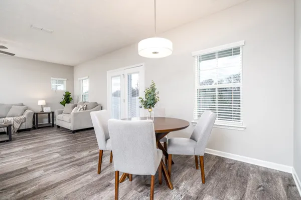 a kitchen with kitchen island granite countertop a sink a center island and appliances