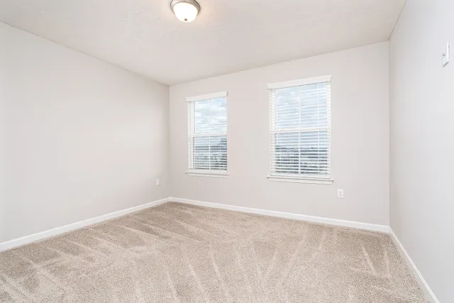 an empty room with closet area
