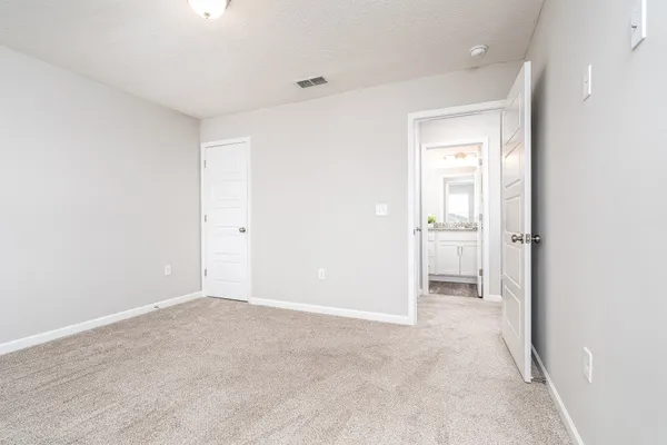 a bathroom with a shower and toilet