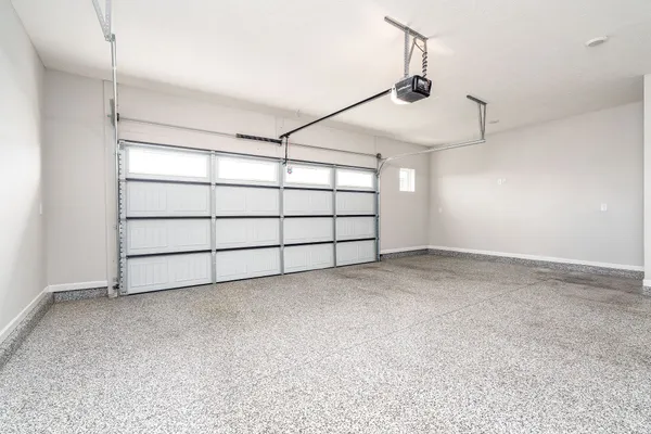 a view of a white house with large windows