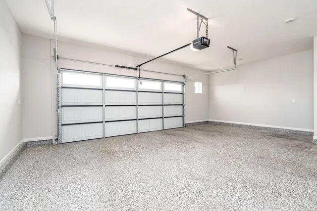 a view of a white house with large windows