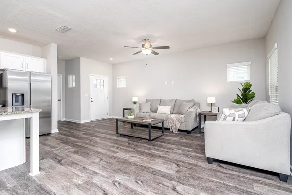 a kitchen with kitchen island granite countertop a sink a center island and stainless steel appliances