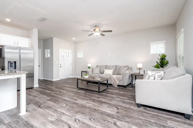 a kitchen with kitchen island granite countertop a sink a center island and stainless steel appliances