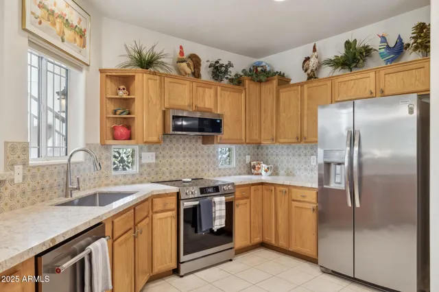 a kitchen with a table and chairs in it