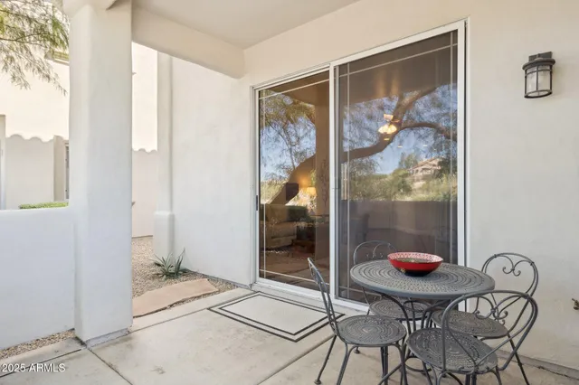 a view of a patio with swimming pool