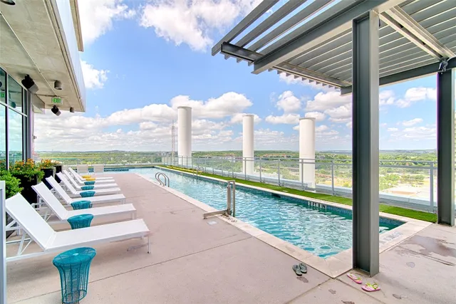 a view of swimming pool with a patio