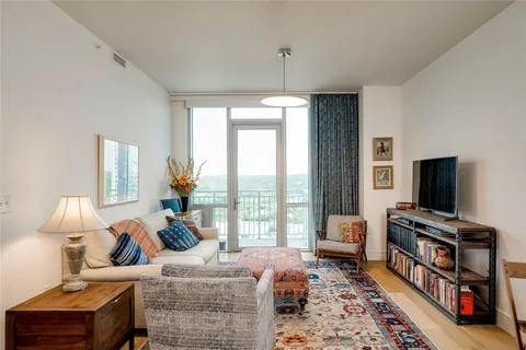 a bedroom with furniture and a flat screen tv
