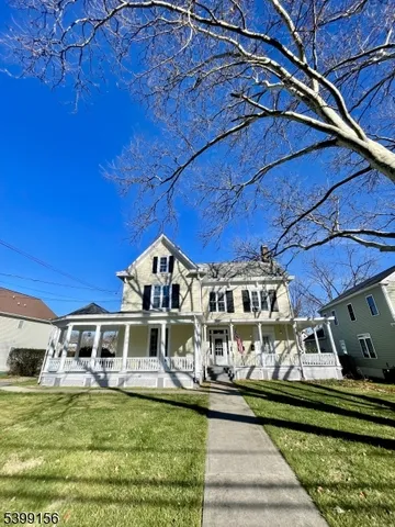 a view of a house with deck and wooden floor