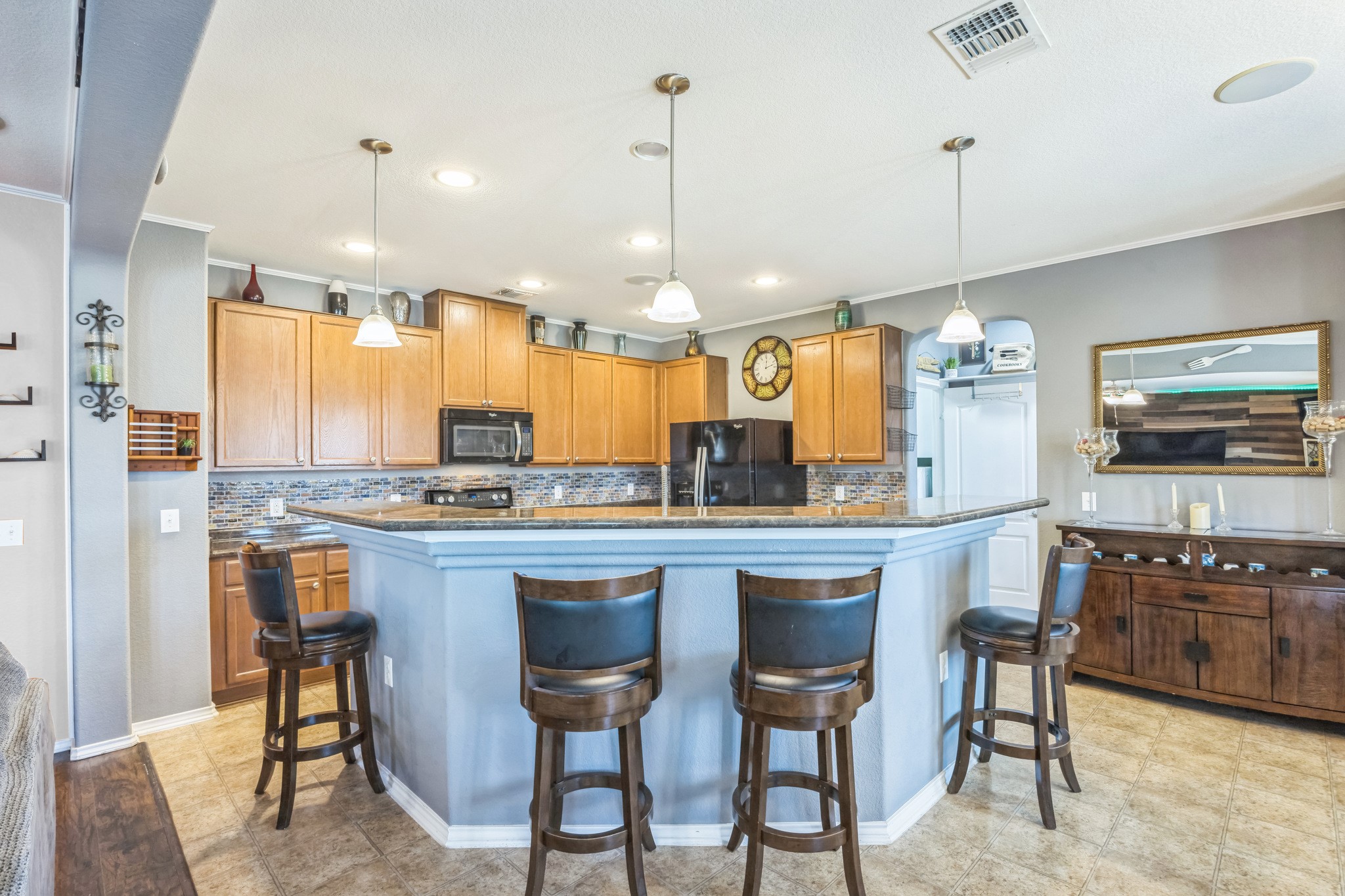 6401 Quinton Drive Austin, TX 78747 - Photo 12 of 29 a large kitchen with a table and chairs in it