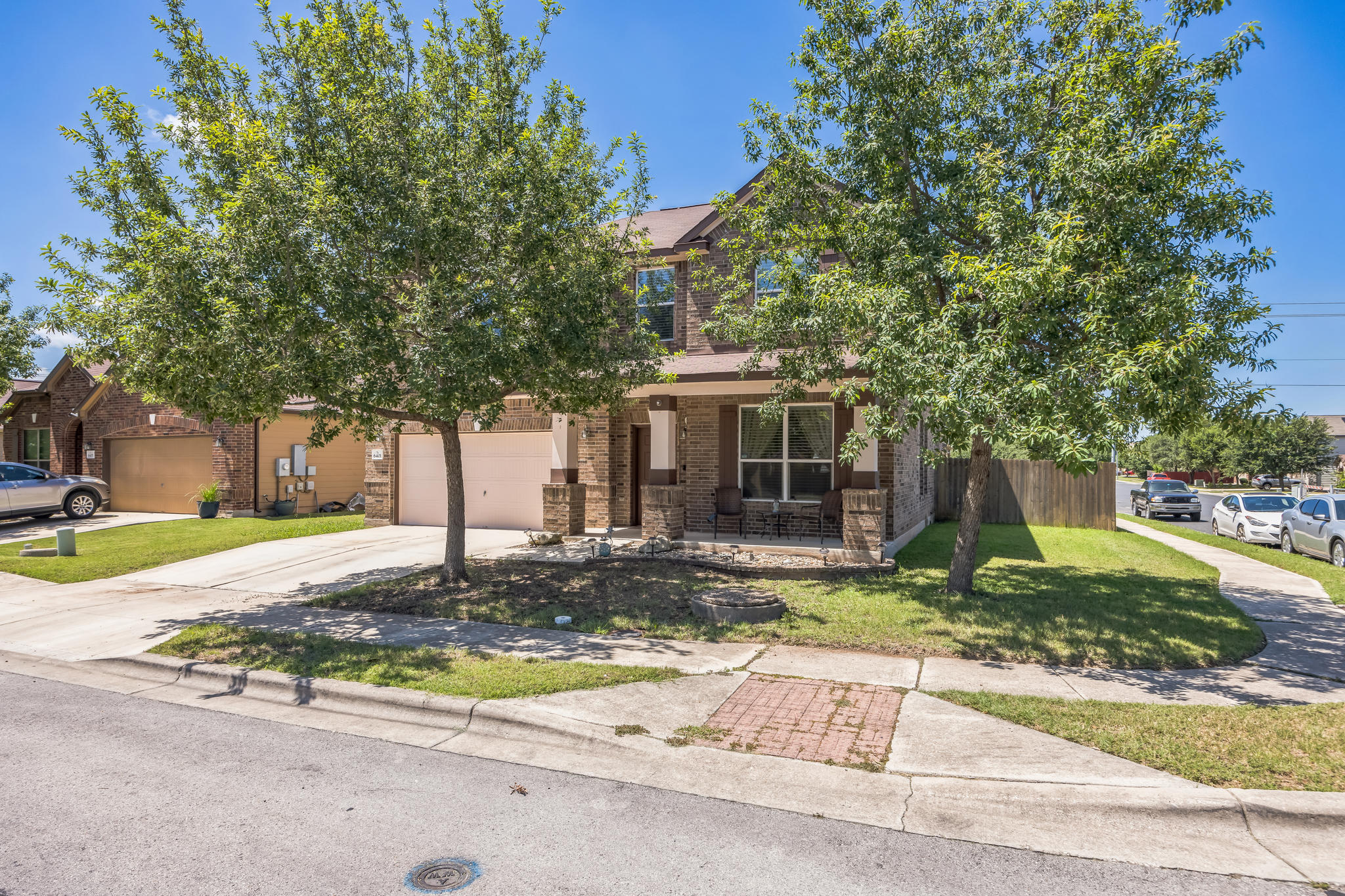6401 Quinton Drive Austin, TX 78747 - Photo 2 of 29 a front view of a house with a yard and garage