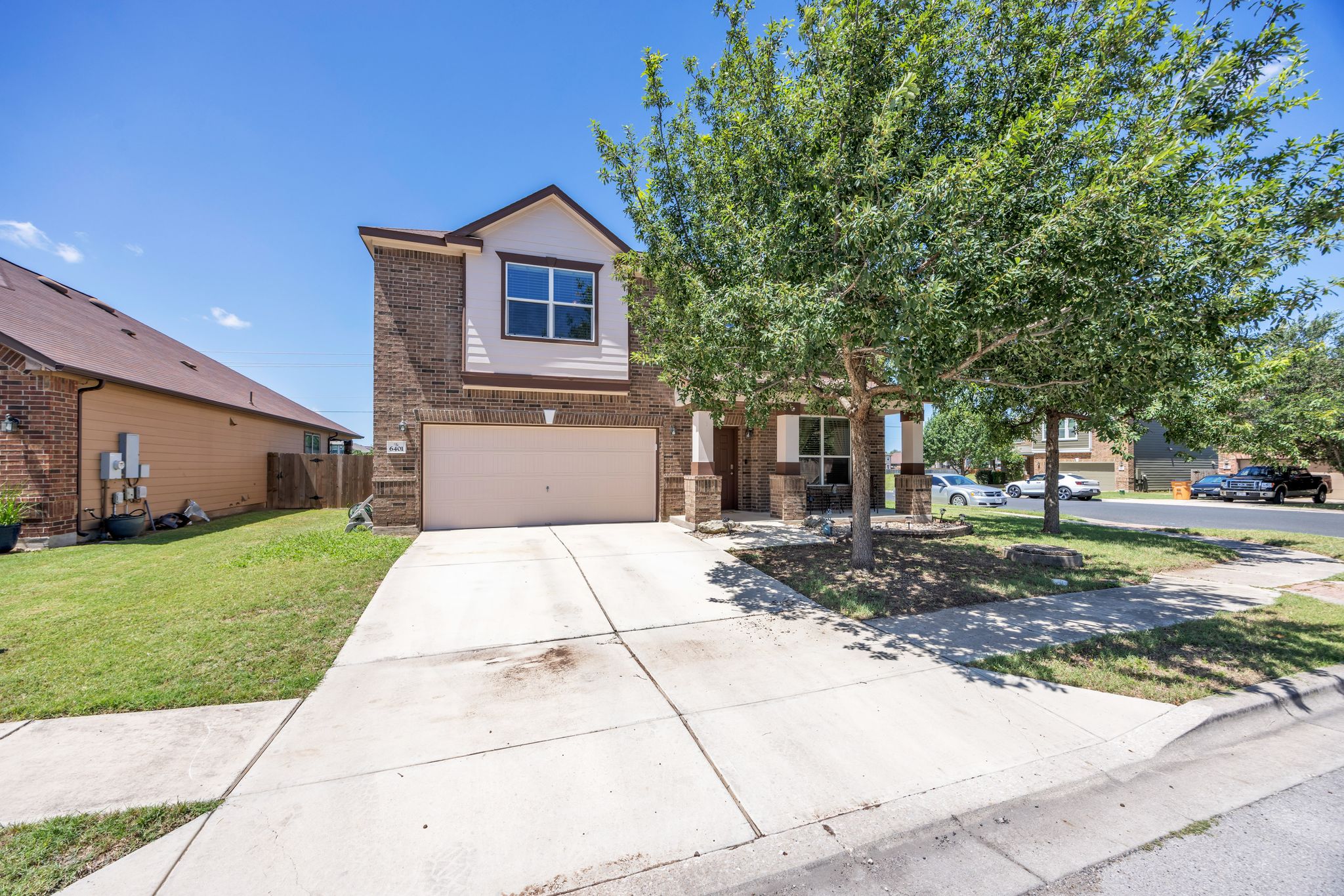 6401 Quinton Drive Austin, TX 78747 - Photo 3 of 29 a front view of a house with a yard and a garage