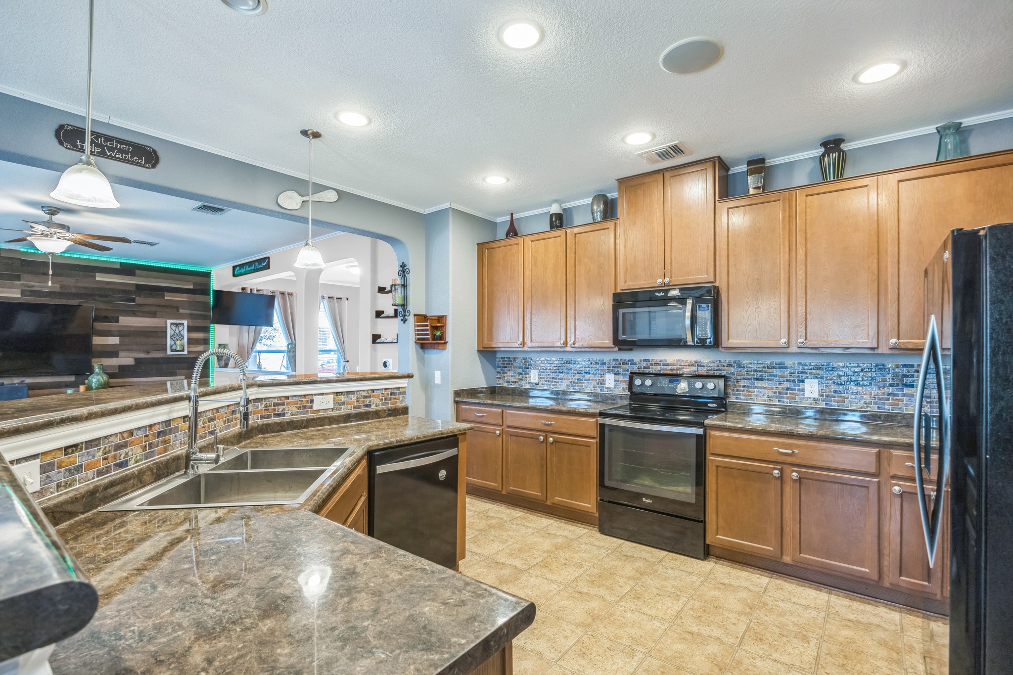 6401 Quinton Drive Austin, TX 78747 - Photo 9 of 29 a kitchen with stainless steel appliances granite countertop a stove and a sink