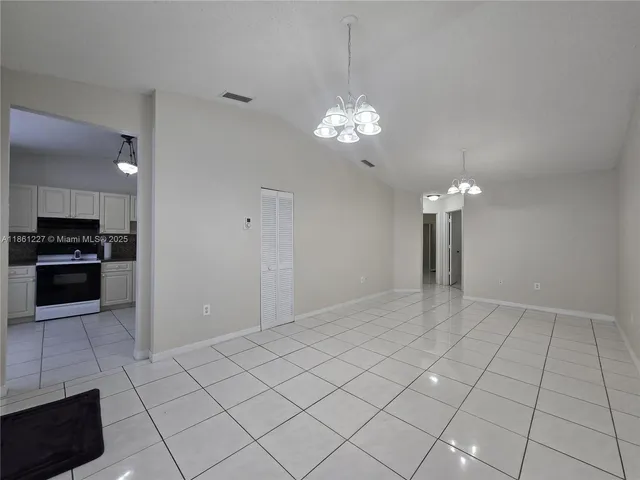 a view of a kitchen with a sink and a kitchen counter top