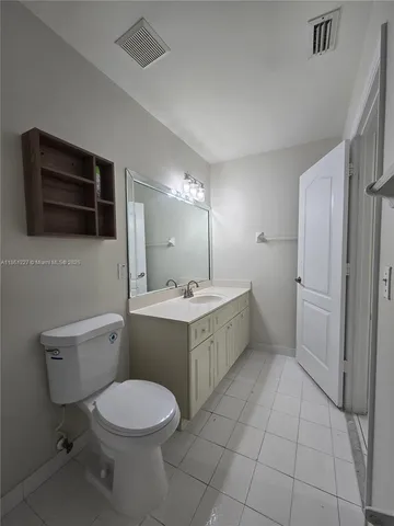 a bathroom with a sink a toilet and bathtub