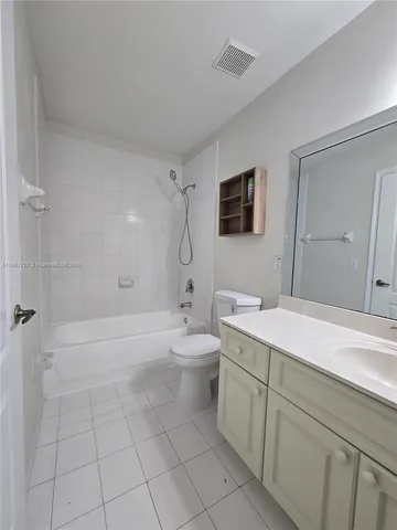 an empty room with a empty space and windows