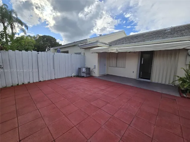 a view of swimming pool with outdoor seating