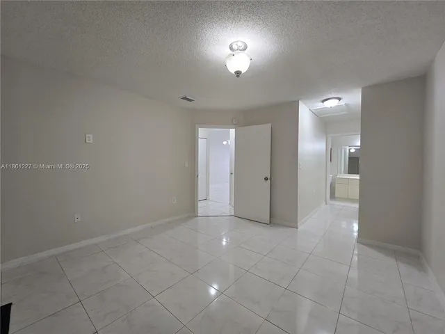 a bathroom with a toilet a sink a mirror and a shower