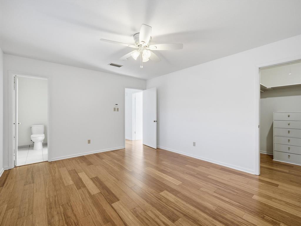 4613 Ranch View Road Fort Worth, TX 76109 - Photo 20 of 24 an empty room with wooden floor and fan