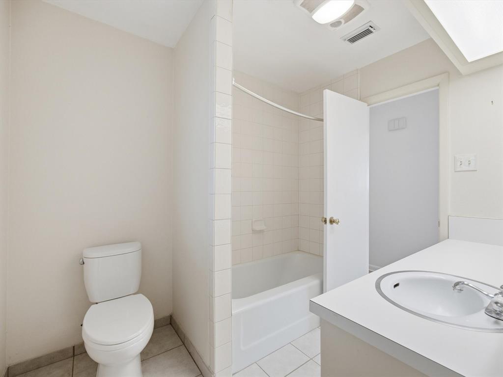 4613 Ranch View Road Fort Worth, TX 76109 - Photo 21 of 24 a bathroom with a toilet a sink and shower