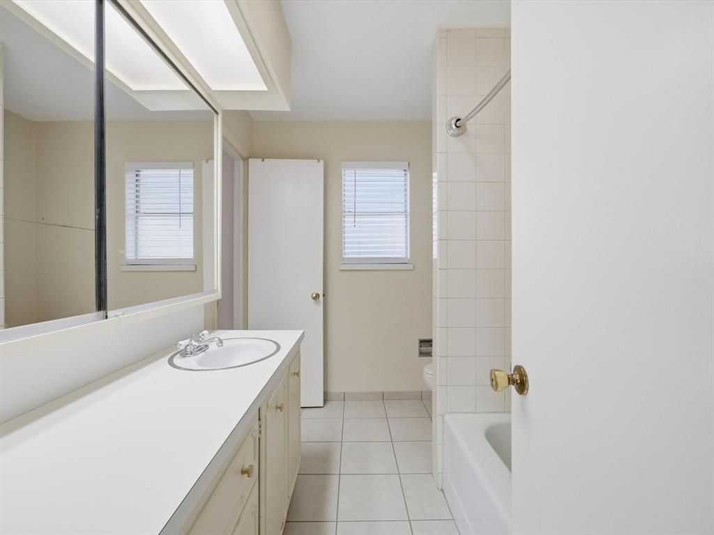 4613 Ranch View Road Fort Worth, TX 76109 - Photo 22 of 24 a bathroom with a sink a tub and a mirror