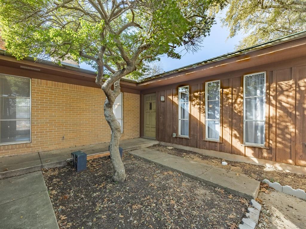 4613 Ranch View Road Fort Worth, TX 76109 - Photo 3 of 24 a front view of a house with garden