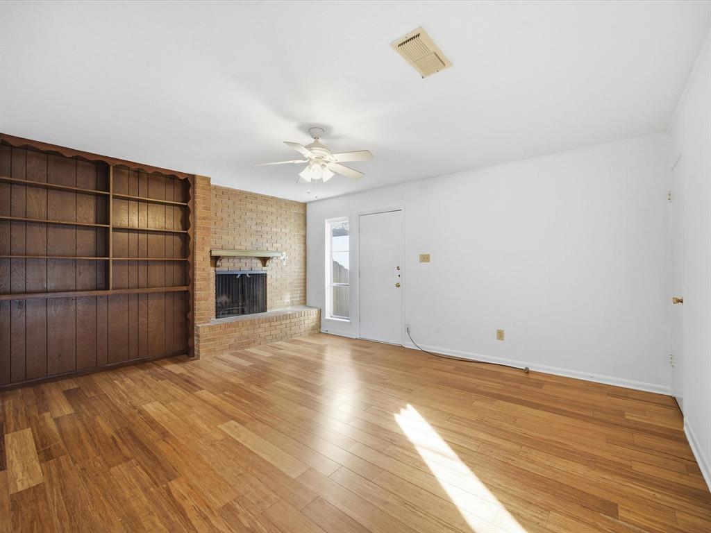 4613 Ranch View Road Fort Worth, TX 76109 - Photo 9 of 24 a view of an empty room with wooden floor