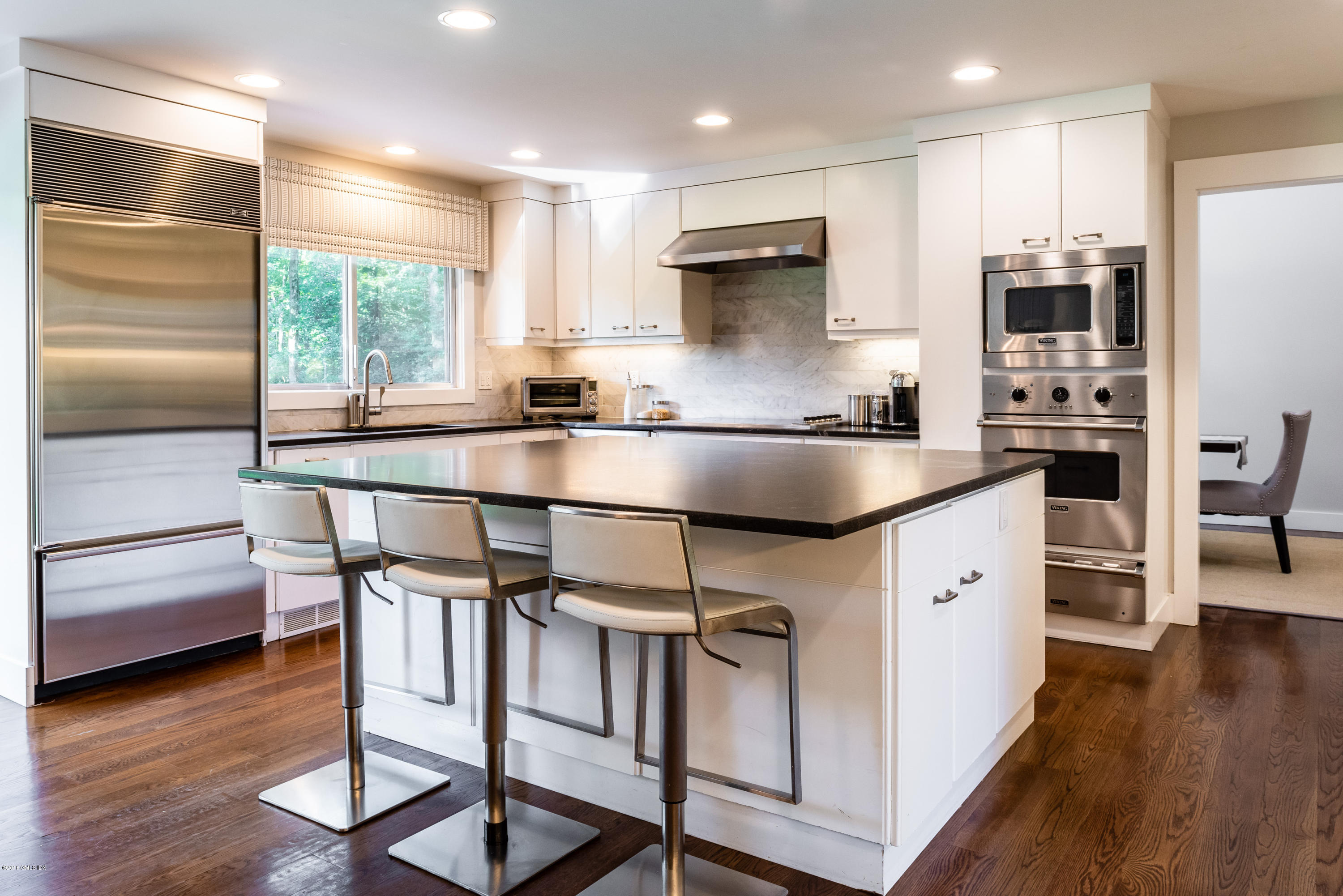 84 Burning Tree Road Greenwich, CT 06830 - Photo 11 of 28 a kitchen with stainless steel appliances granite countertop a stove a sink and a refrigerator