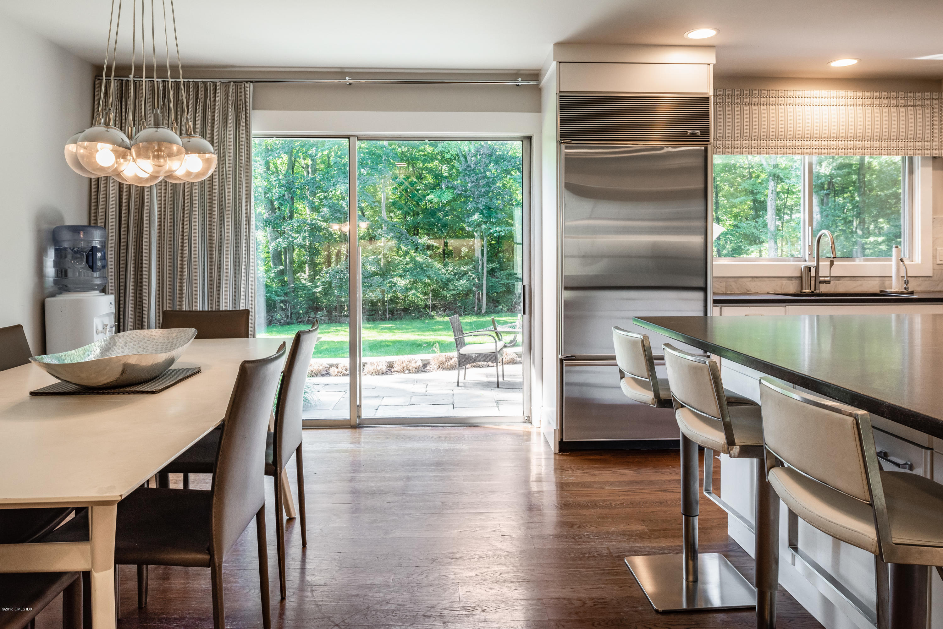 84 Burning Tree Road Greenwich, CT 06830 - Photo 13 of 28 a dining room with furniture and wooden floor