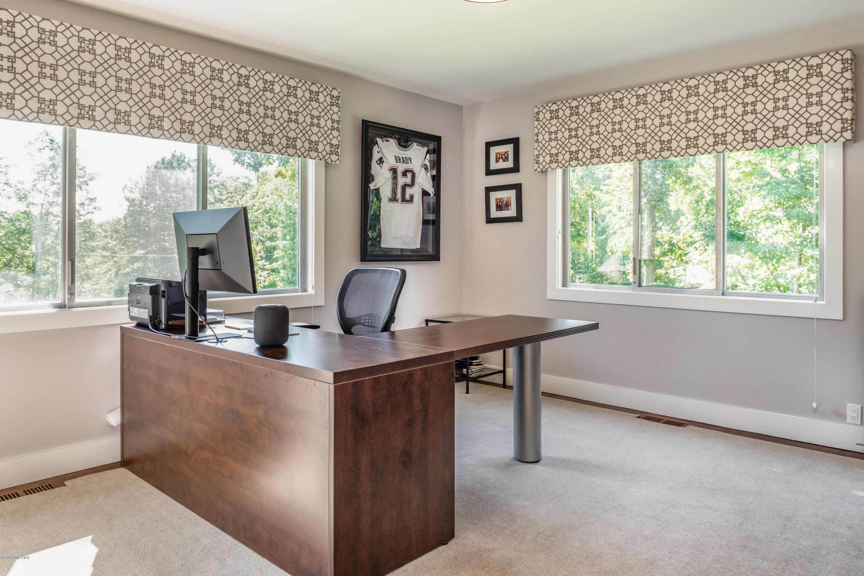 84 Burning Tree Road Greenwich, CT 06830 - Photo 15 of 28 a view of a room with a large window and dining table