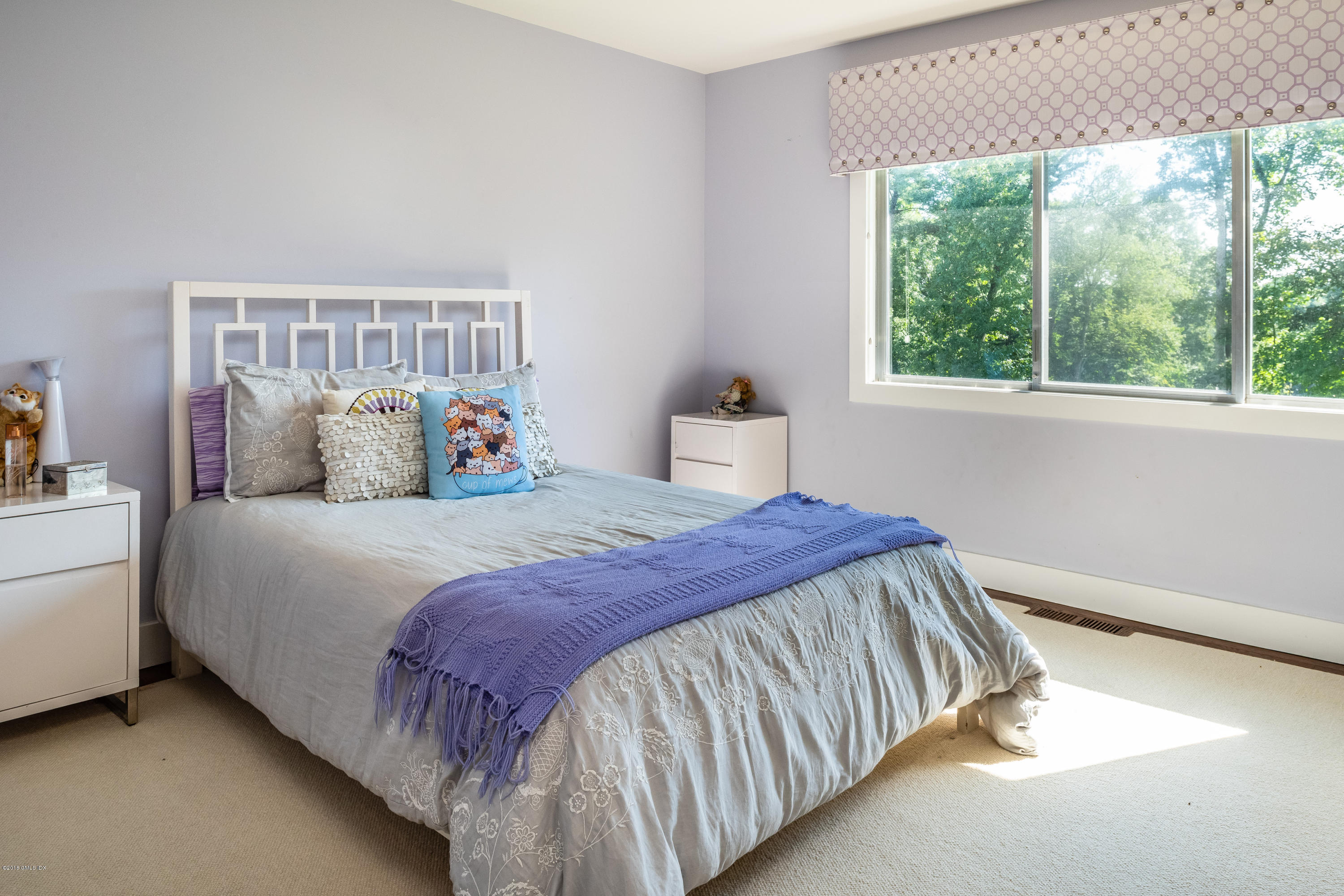84 Burning Tree Road Greenwich, CT 06830 - Photo 16 of 28 a bedroom with a bed and window