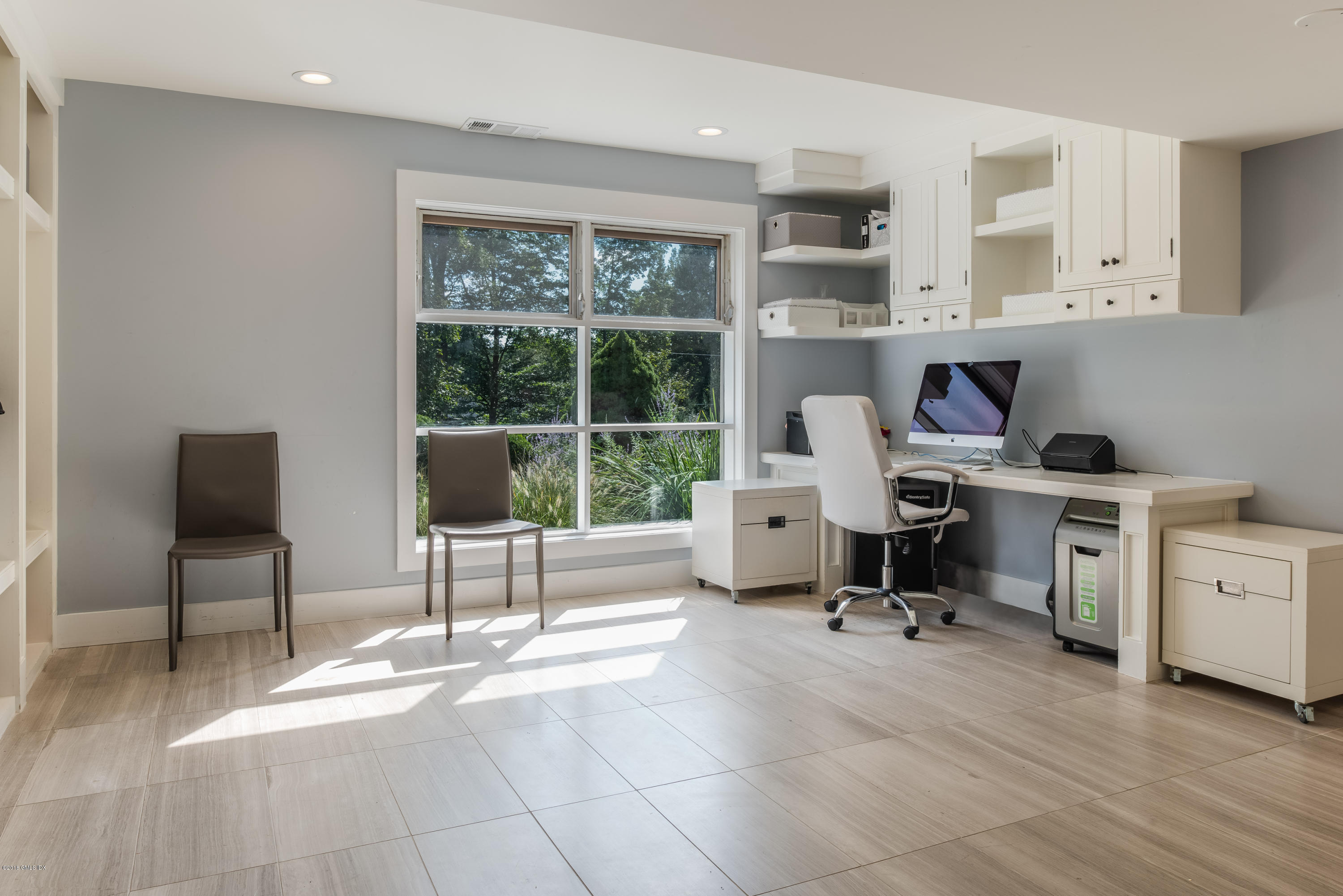 84 Burning Tree Road Greenwich, CT 06830 - Photo 23 of 28 a view of a workspace with furniture and a window