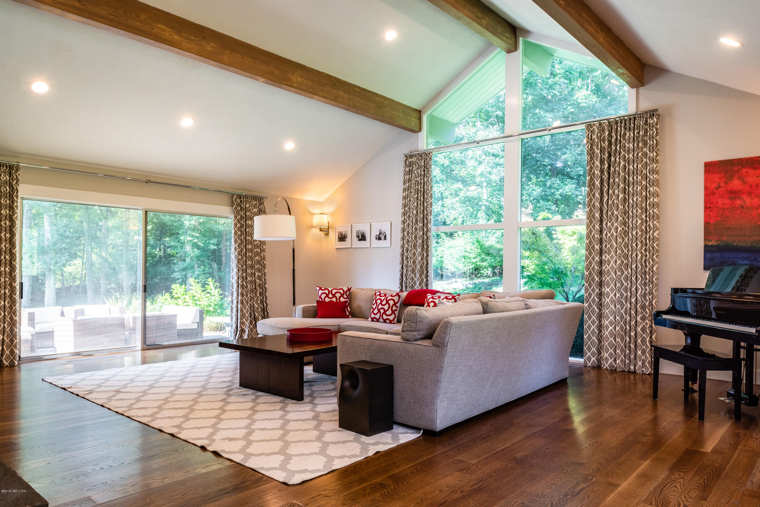 84 Burning Tree Road Greenwich, CT 06830 - Photo 8 of 28 a living room with furniture and a large window